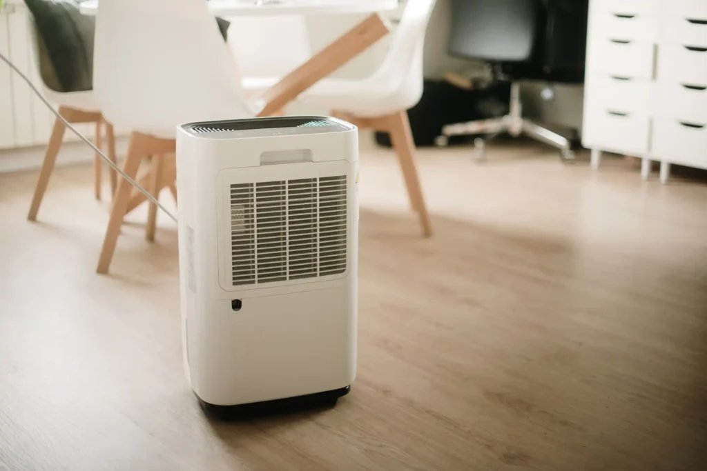 Dehumidifier Installation In Katy, TX 1 Dehumidifier unit placed on the floor, enhancing the comfort of the room's interior